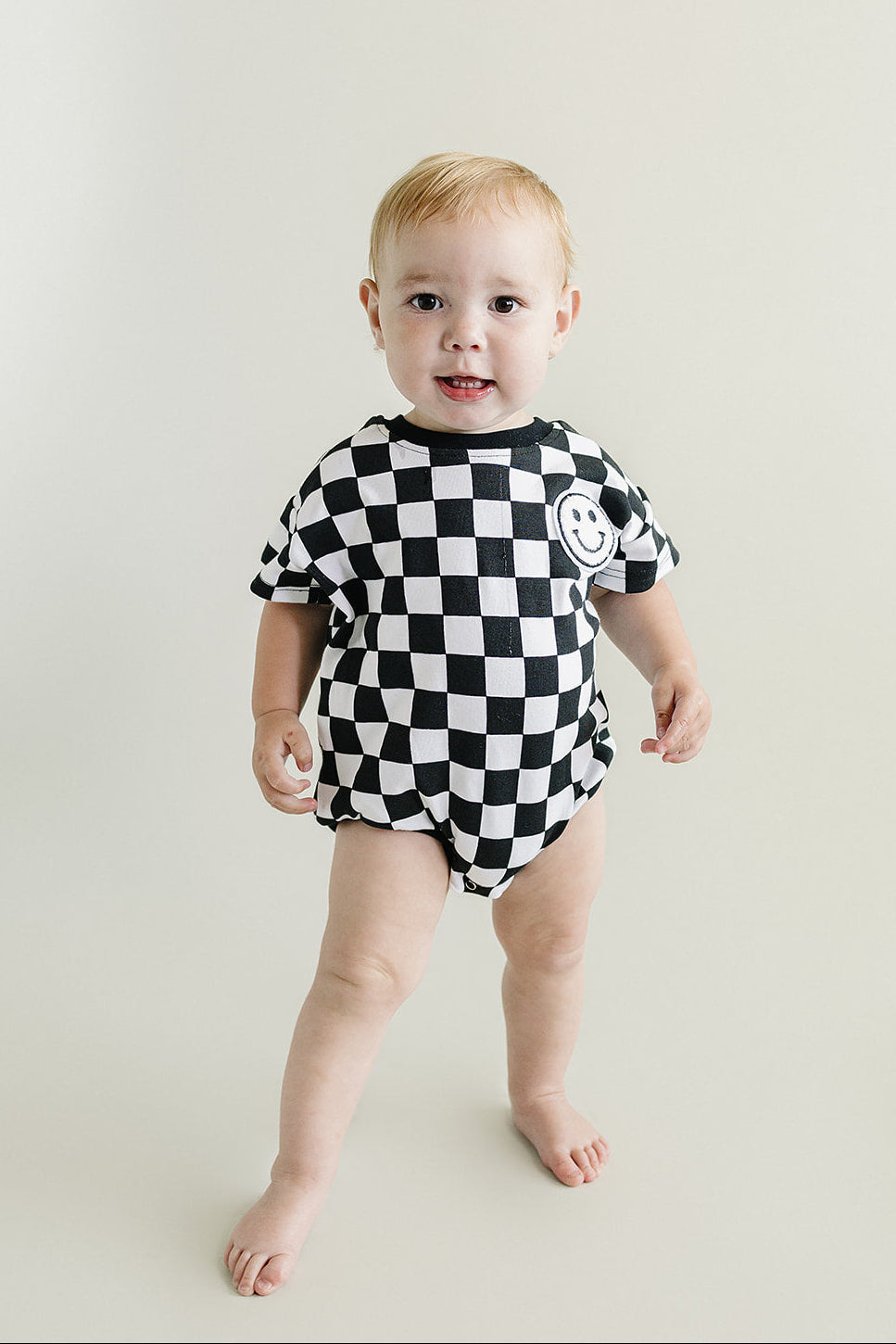 Checkered Smiley Black Short Sleeve Bubble Romper