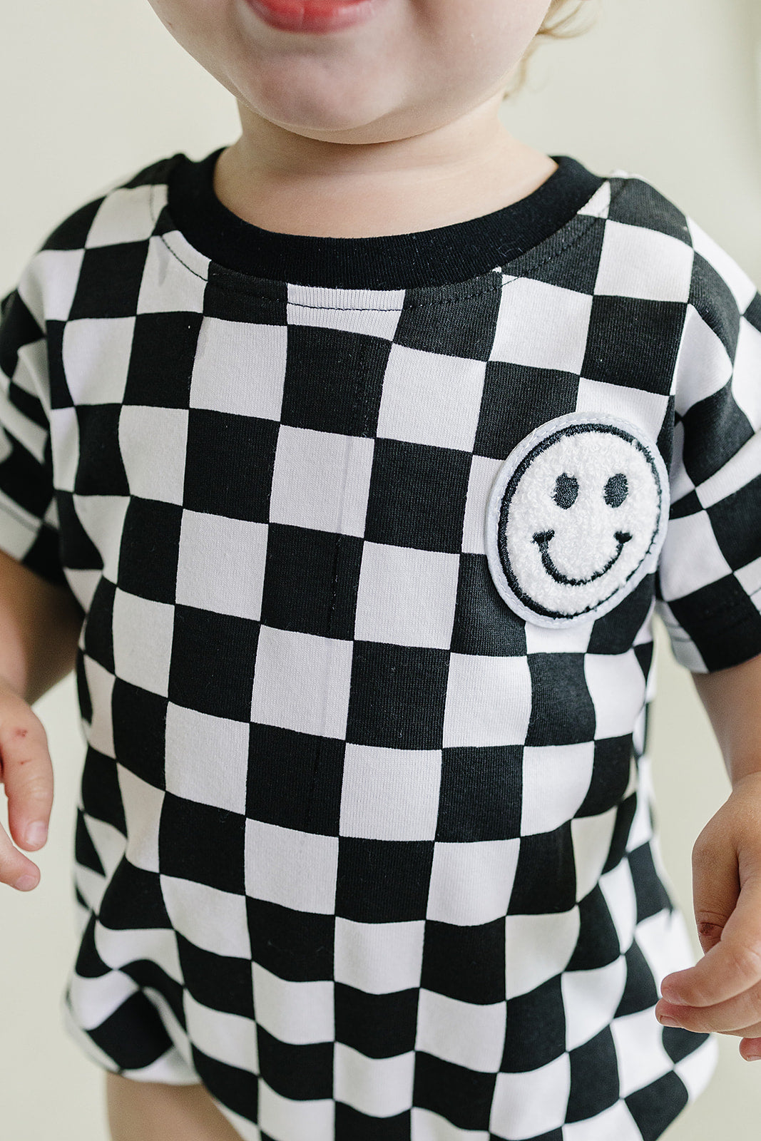 Checkered Smiley Black Short Sleeve Bubble Romper