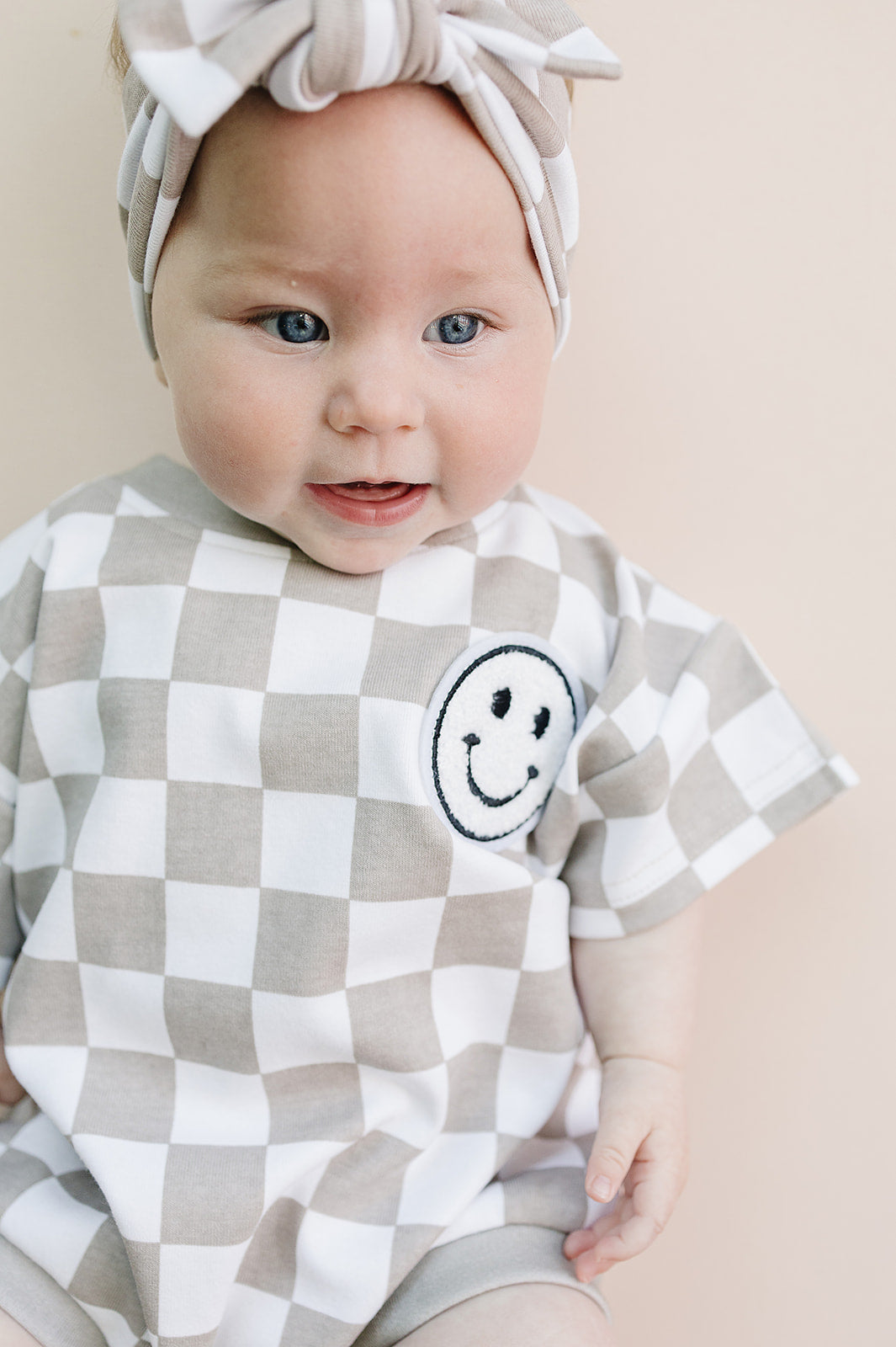 Latte Checkered Smiley Short Sleeve Bubble Romper