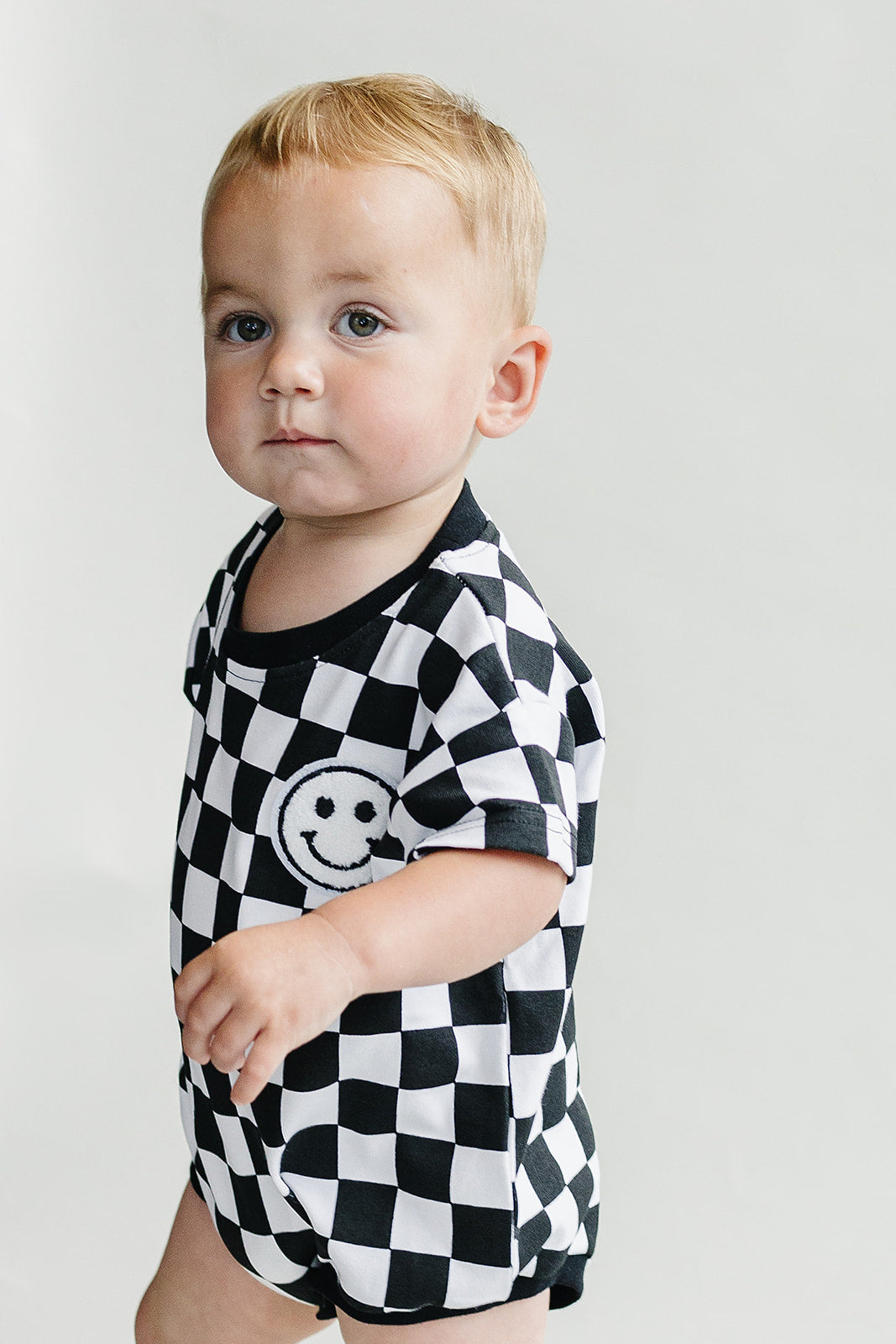 Checkered Smiley Black Short Sleeve Bubble Romper