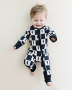 Baby Bamboo Zip Romper with Cream and Black Checkered Pattern and Bolts