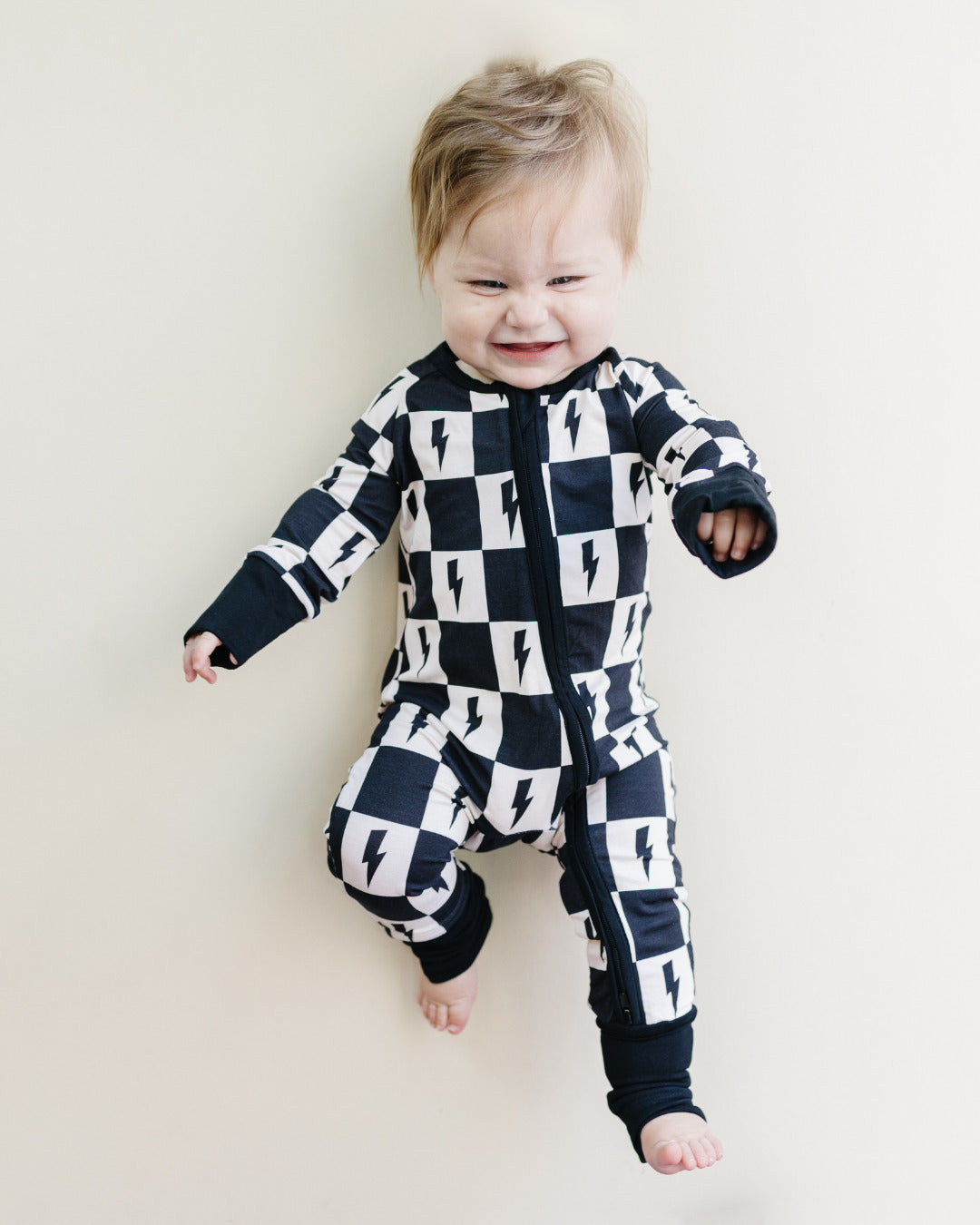 Baby Bamboo Zip Romper with Cream and Black Checkered Pattern and Bolts