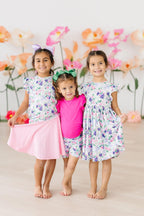 girl wearing twirl shorts under dress on playground or at school