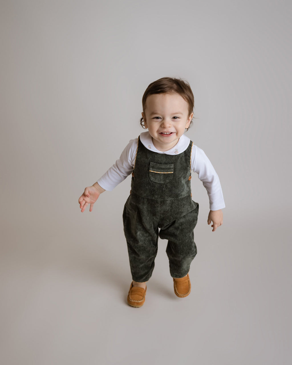 Elegant Forest Green Corduroy Boy Overalls with yellow gingham trim and wooden buttons, ideal for stylish fall and holiday wear by Cuclie
