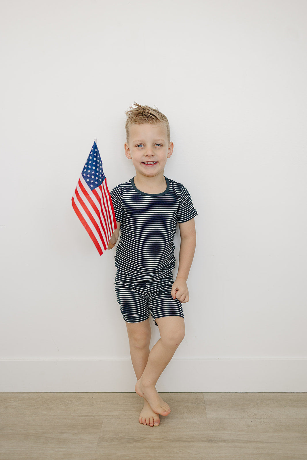 toddler bamboo short set in navy stripes two-piece outfit holding american flag from Meibi Baby Collection
