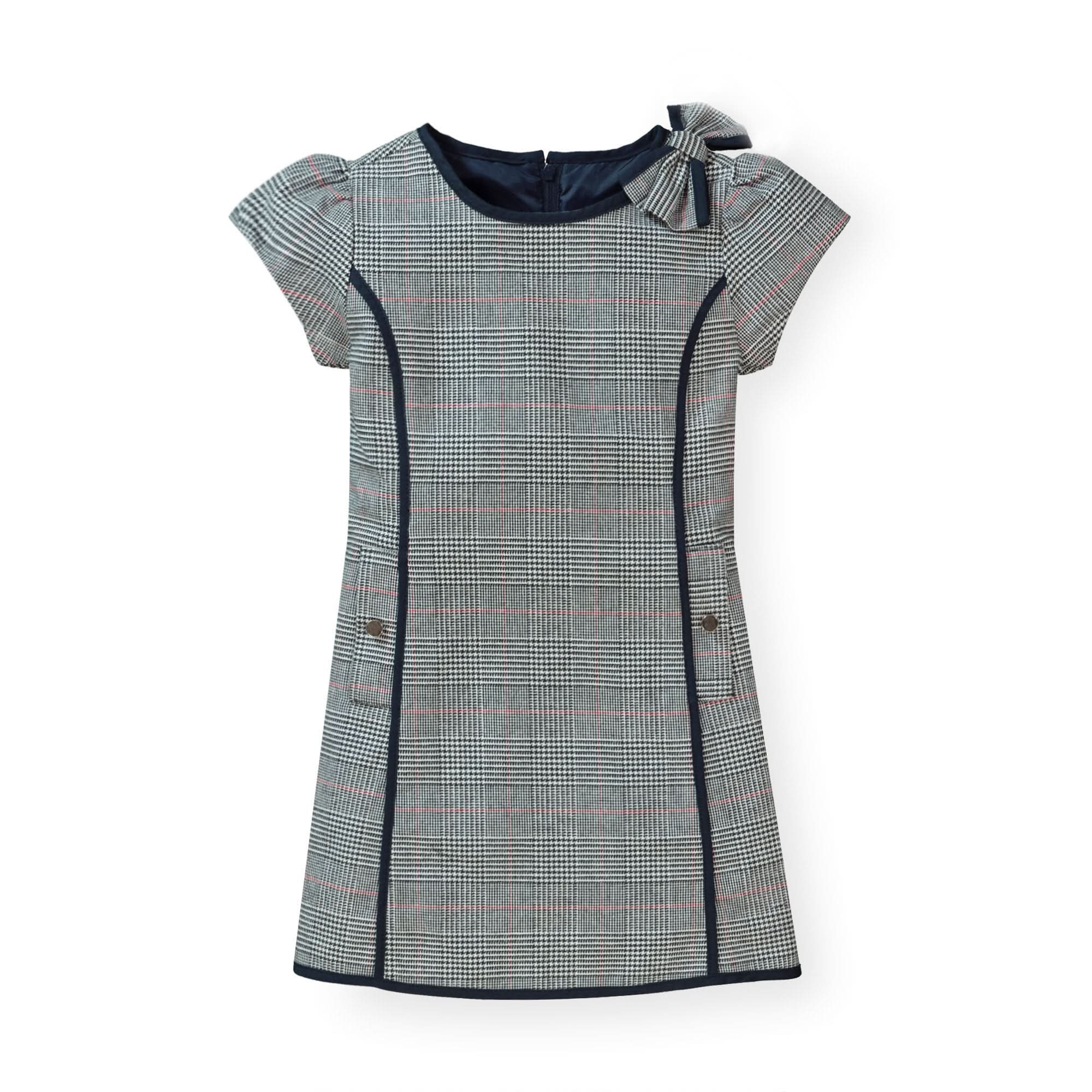 Plaid dress with a bow detail on a white background