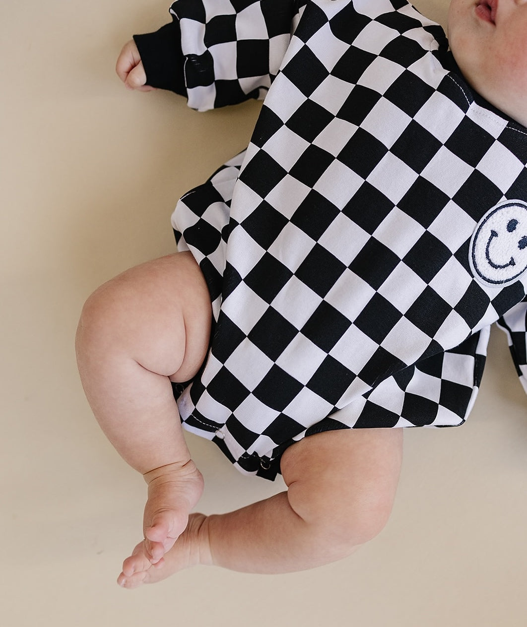 Bubble Romper | Checkered Smiley Black
