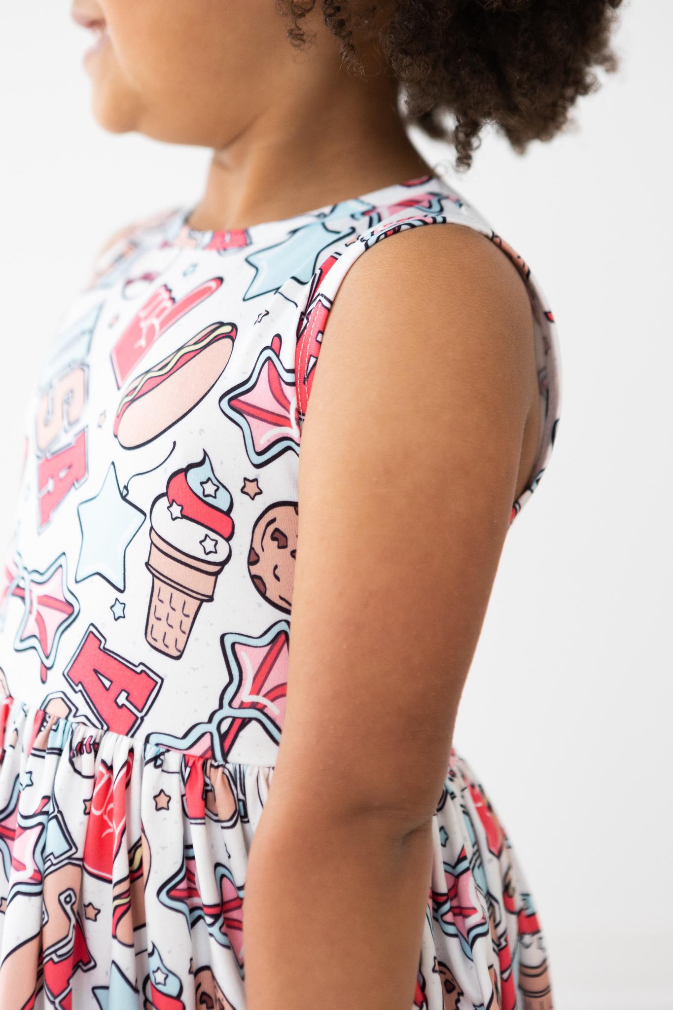child wearing red white & BBQ tank dress at summer party