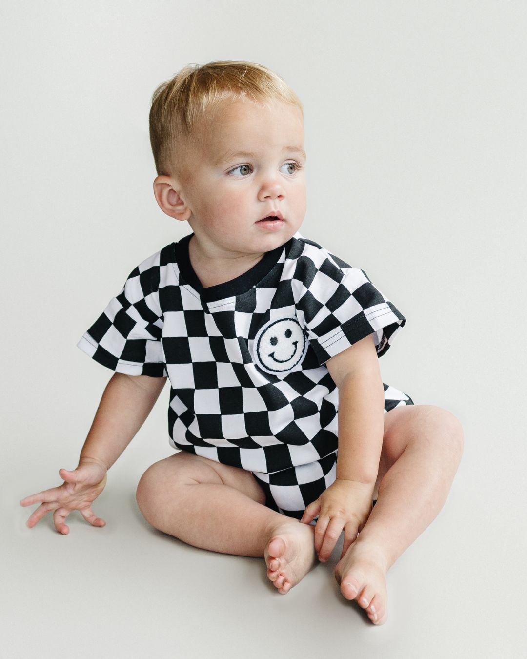 Checkered Smiley Black Short Sleeve Bubble Romper