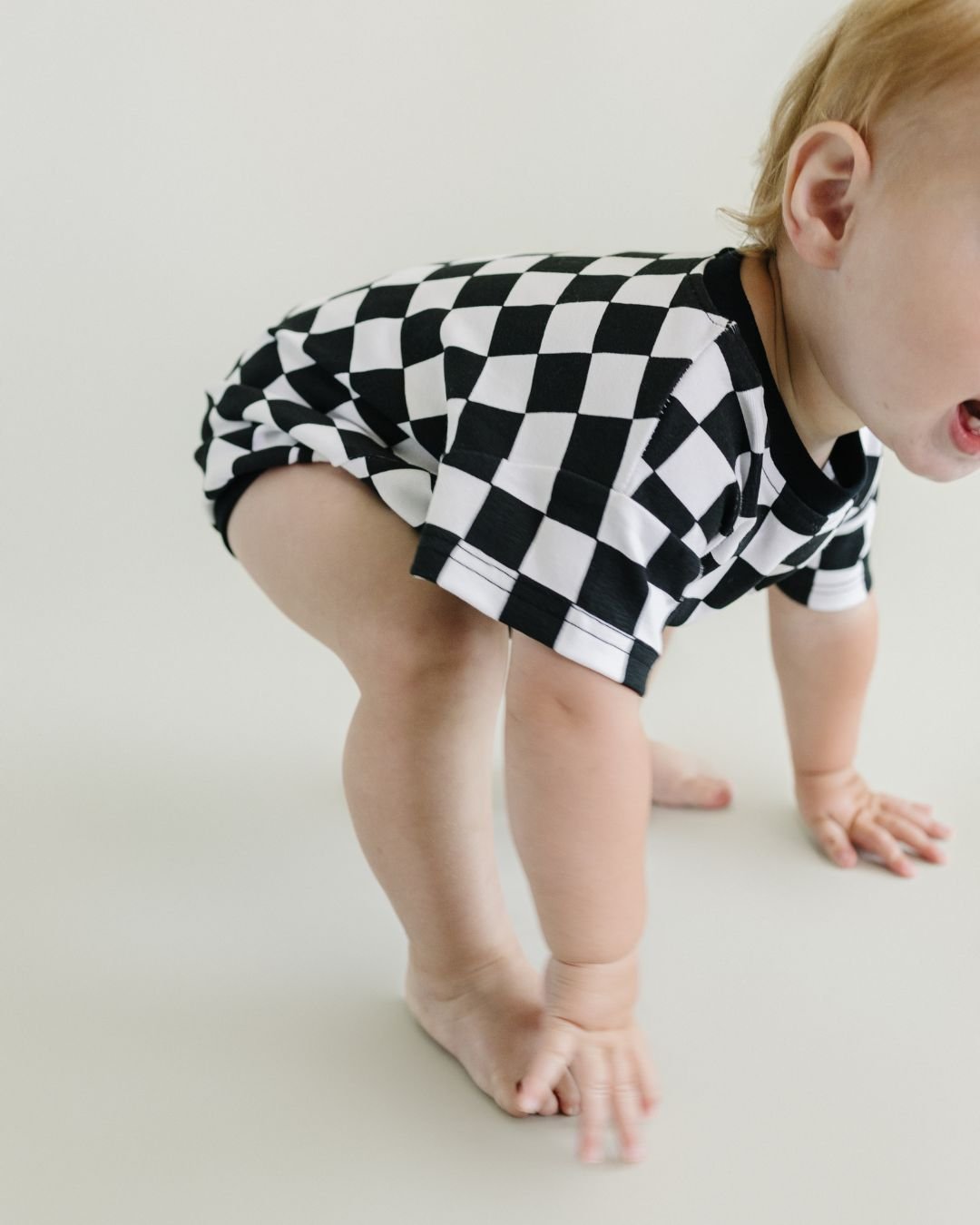 Checkered Smiley Black Short Sleeve Bubble Romper