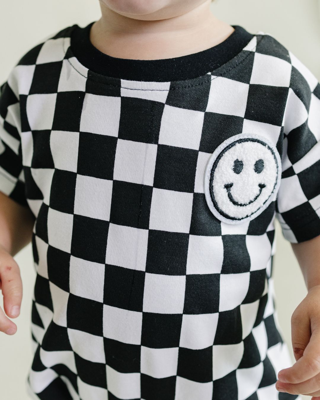 Checkered Smiley Black Short Sleeve Bubble Romper
