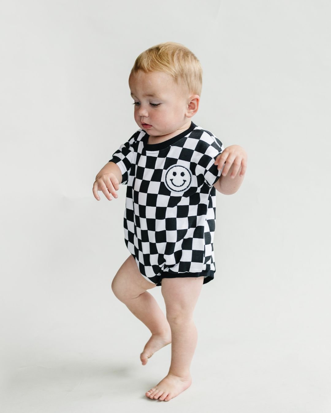 Checkered Smiley Black Short Sleeve Bubble Romper