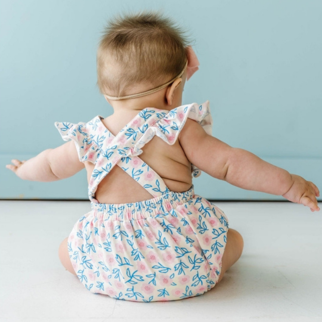 Our Emmy Romper is super soft and stretchy for little ones who love to move! This adorable spring print is the perfect little sister summer outfit for our matching Olivia Dress! Featuring ruffled details along the shoulders and down the back, as well as adjustable straps for growing babes. A three-snap closure makes for easy diaper changes.
