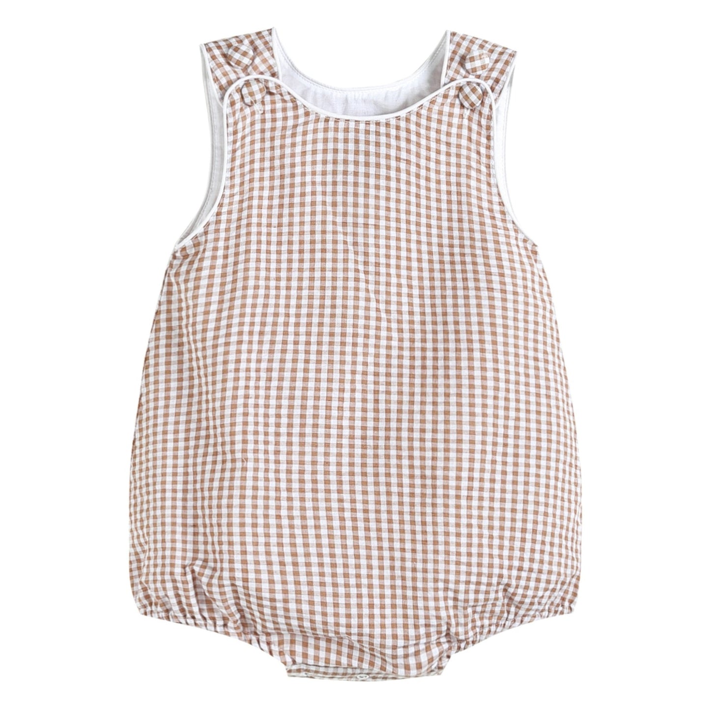 Instant Closet Classic! This comfortable and sweet romper is perfect for everyday fun for your little cutie. Great option for custom embroidery or monogram. Lightweight and soft brown gingham cotton is fully lined. Two adjustable fabric covered buttons and snaps for easy changing. Sizing goes up to 2T. 